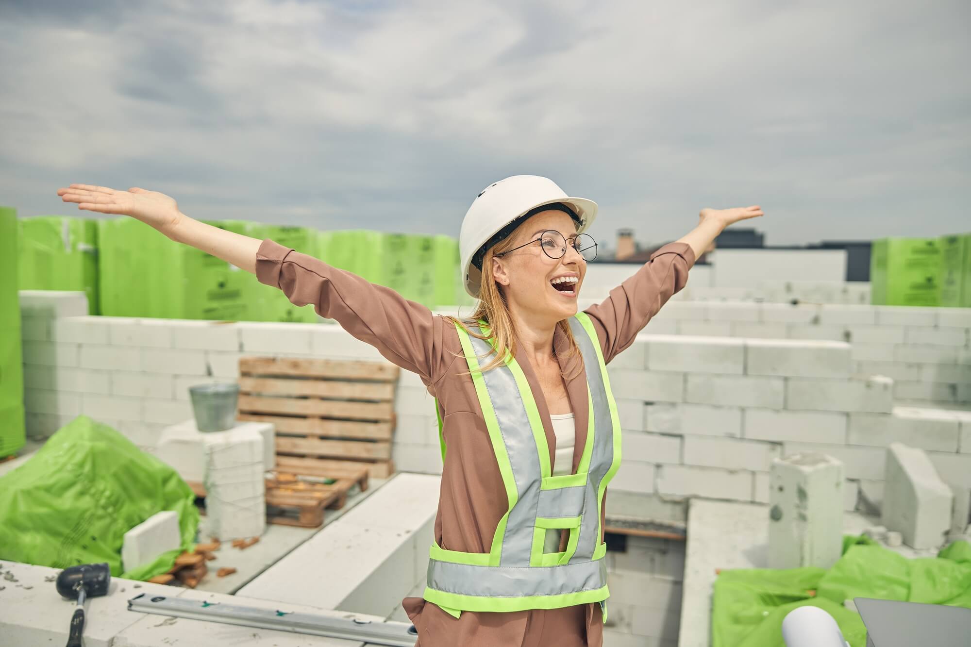 female-contractor-admiring-a-new-construction-object.jpg